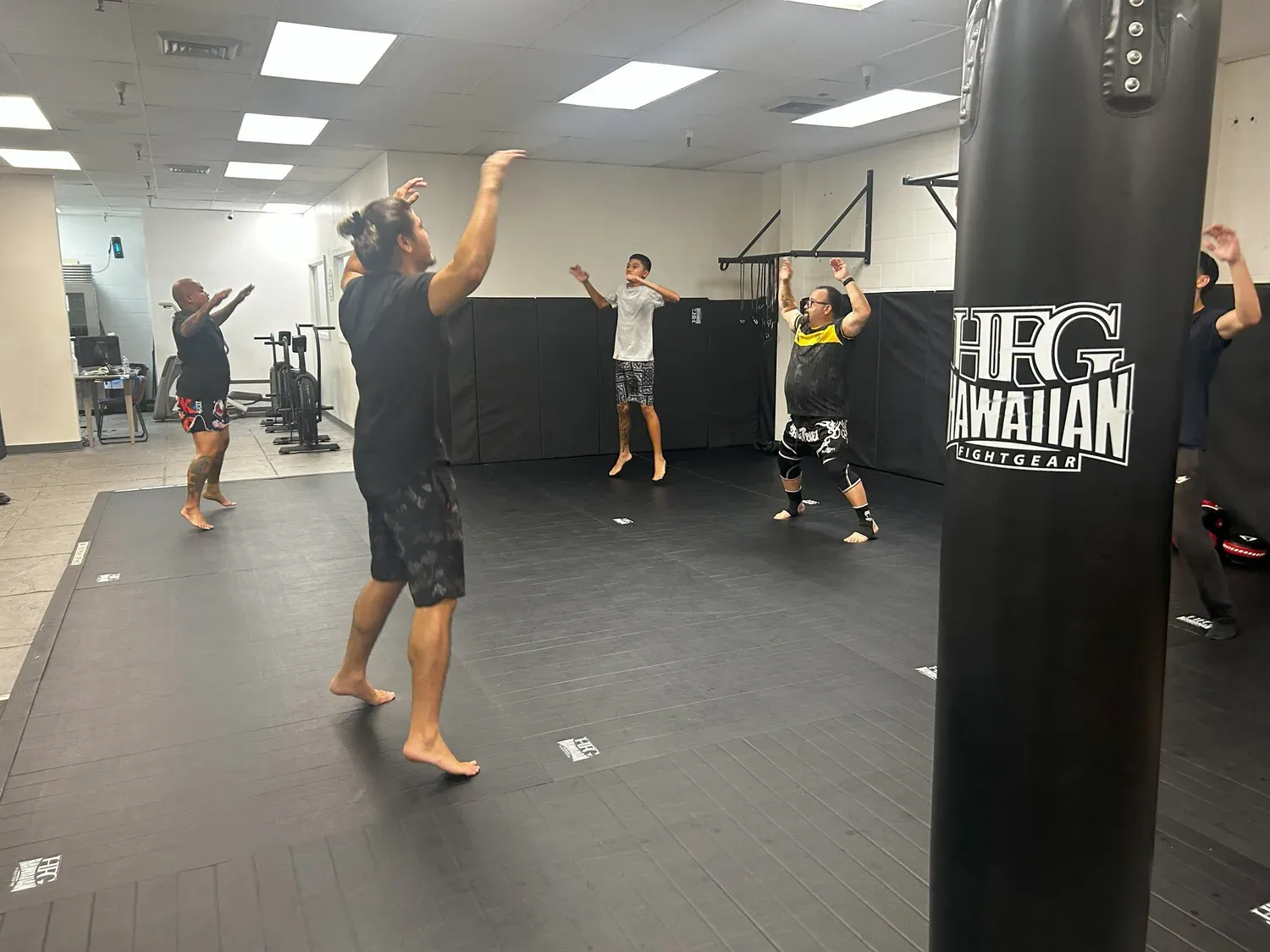 Iron Kingz students shadowboxing during a class